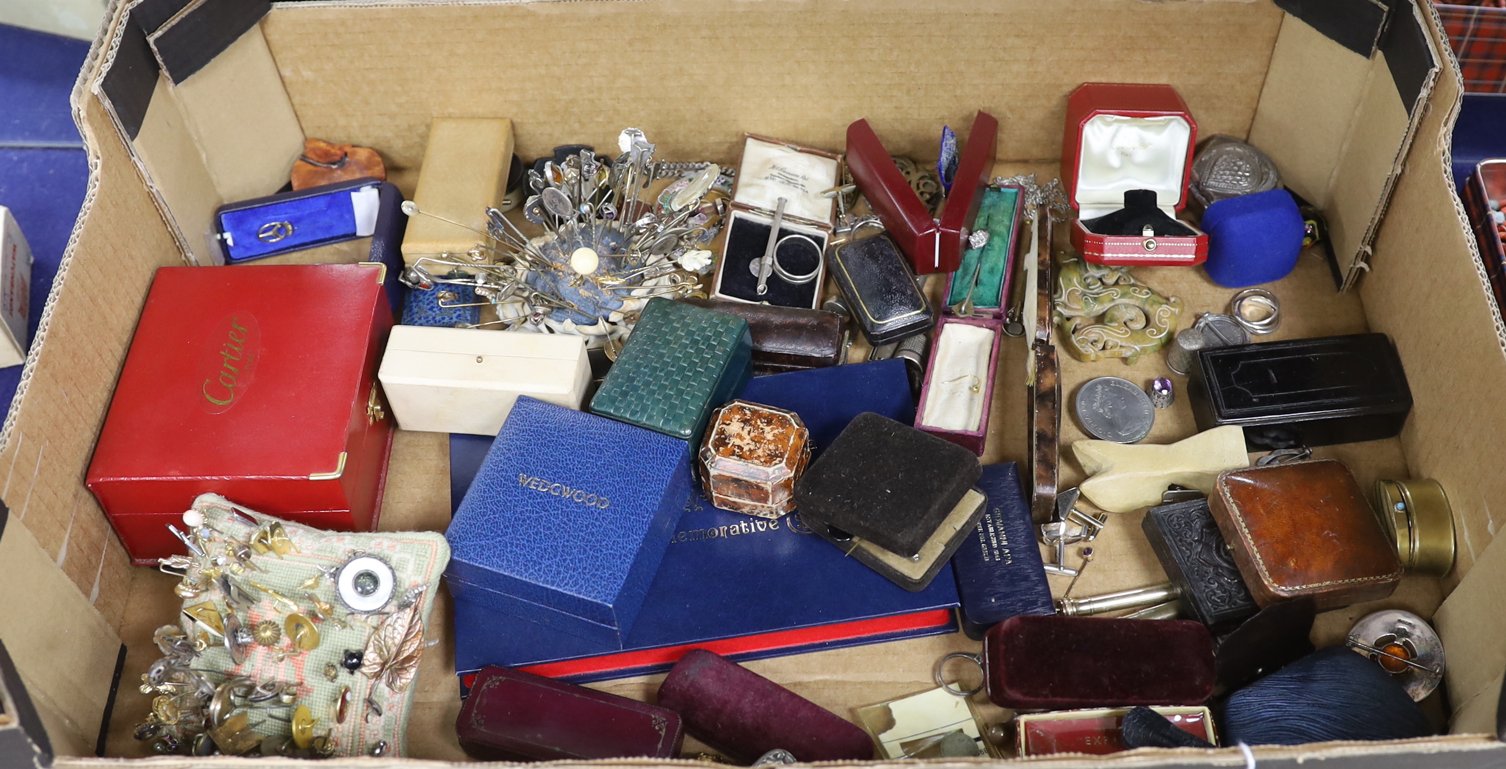 A large quantity of assorted collectables and curios including stick pins, brooches, pens, Links silver cufflinks, coins, jewellery boxes including two Cartier, rings, pendants etc.